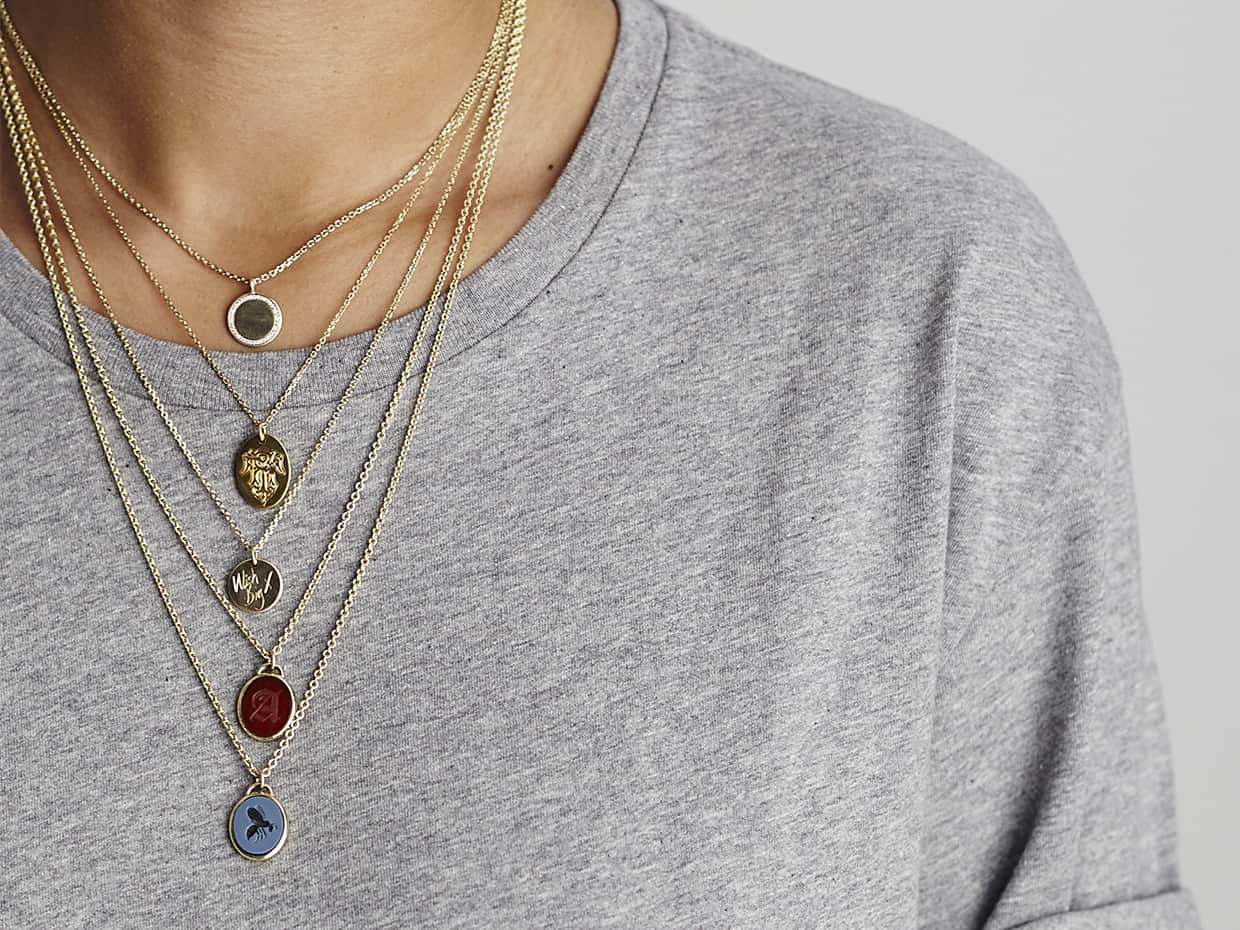 Bespoke Rebus hand engraved pendant necklaces in various metals including gold and precious stones